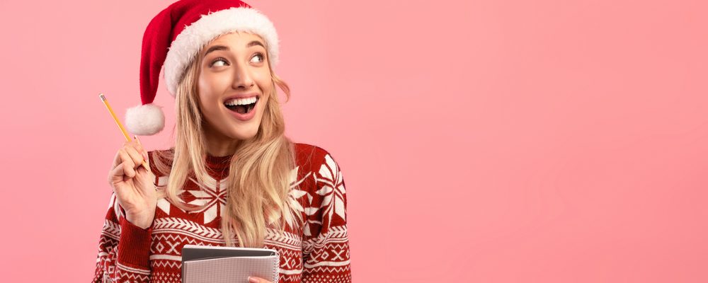 Excited,Millennial,Lady,In,Christmas,Outfit,Writing,New,Year,Resolutions